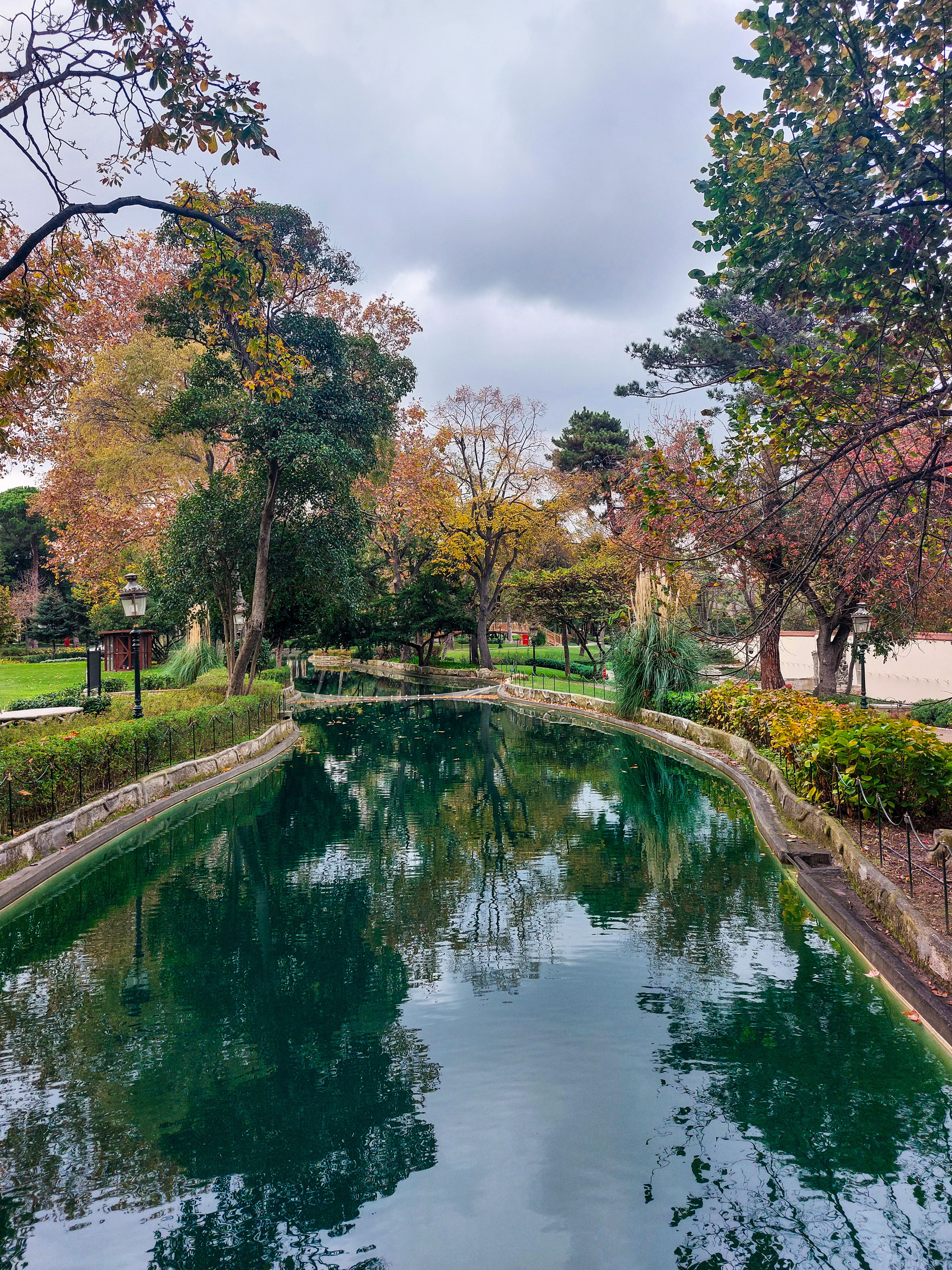 Serene Park Canal with Autumn Foliage Reflection · Free Stock Photo