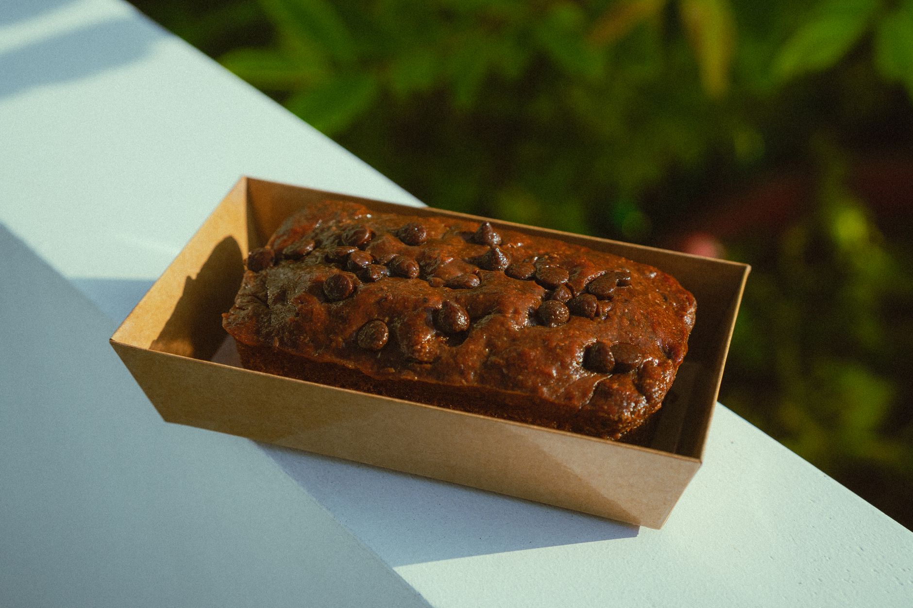 Moist banana cake with chocolate chips slice of banana cake with chocolate chips
