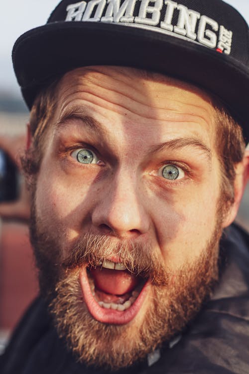 Man Wearing Black Fitted Cap 