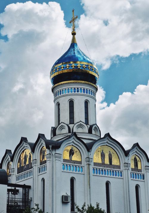 Free Stunning view of an Orthodox church with a blue dome against a vibrant sky. Stock Photo