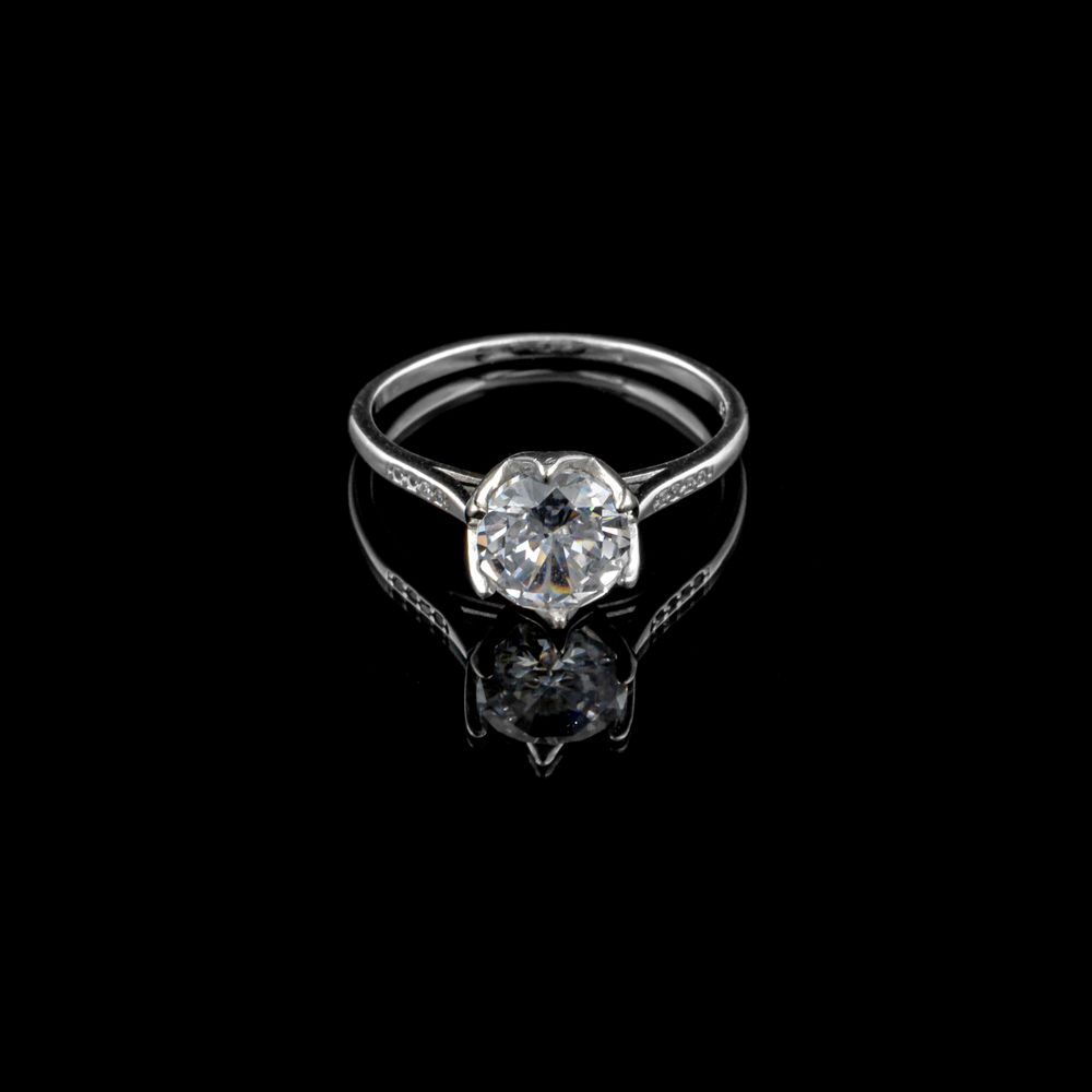 Elegant diamond ring on a dark background