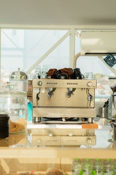 Chic café setup featuring a professional coffee machine with accessories, perfect for coffee culture themes.