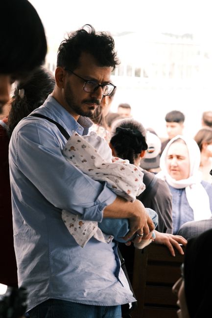 father holding baby