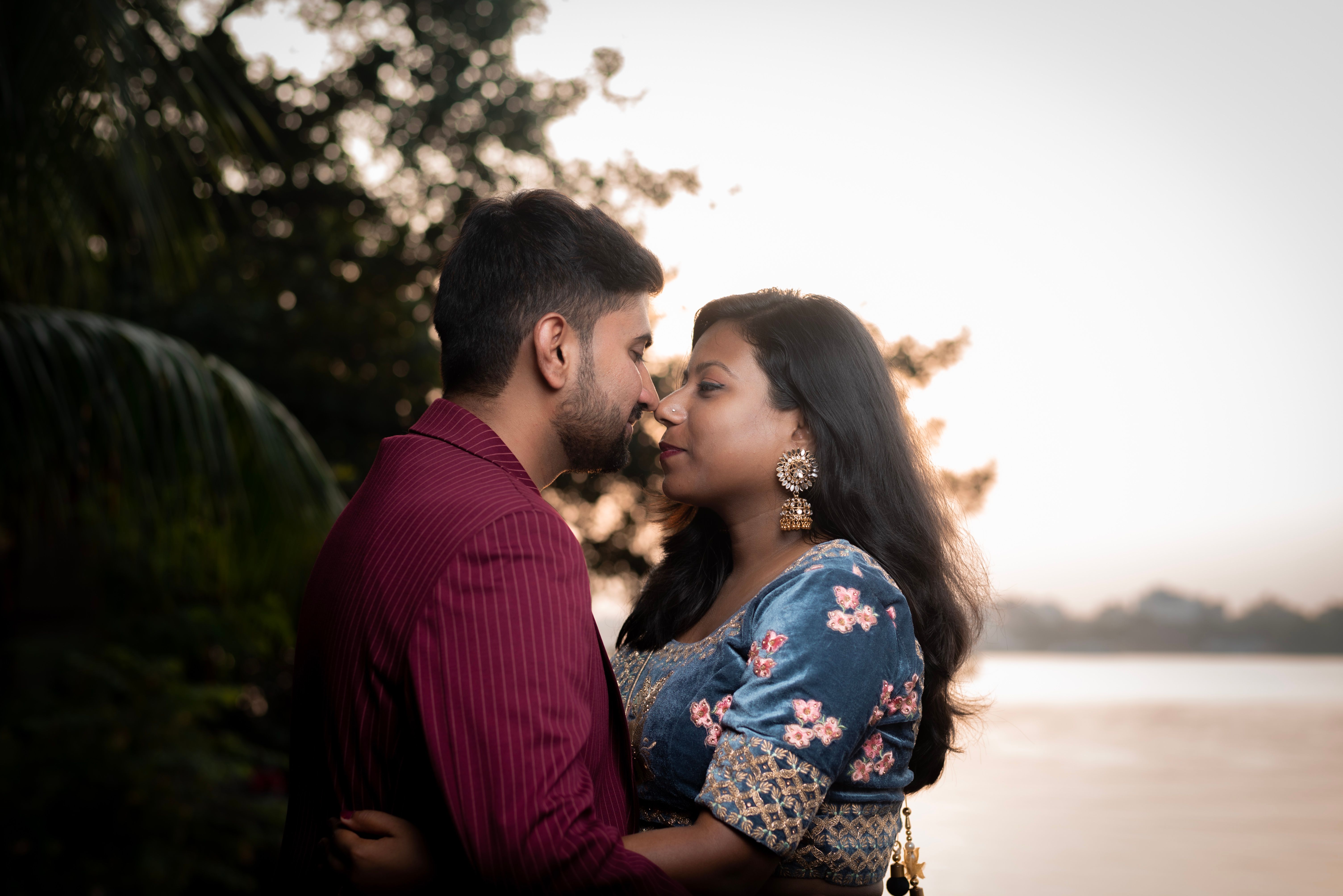 Pre-wedding couple riverside sunset