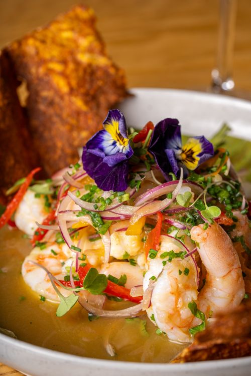 Free Vibrant shrimp ceviche garnished with fresh herbs and colorful edible flowers, perfect for gourmet dining. Stock Photo