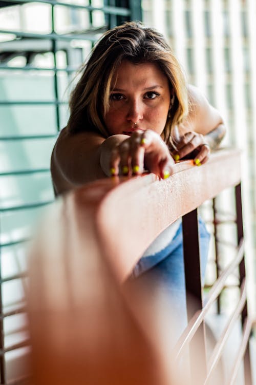  Woman Leaning Her Body On A Railing