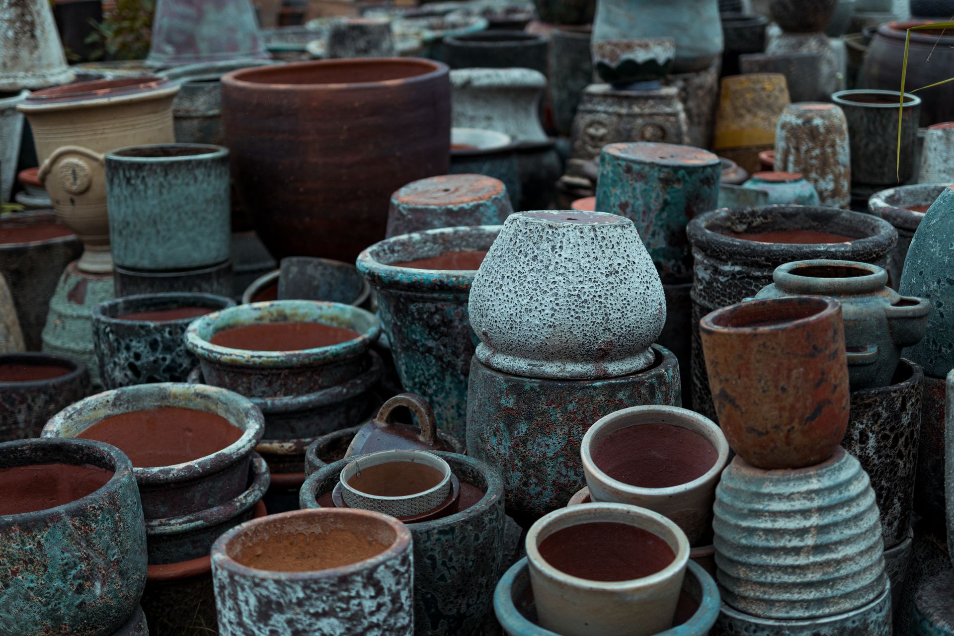 A variety of ceramic pots displayed outdoors at a market in Bien Hoa, Vietnam.