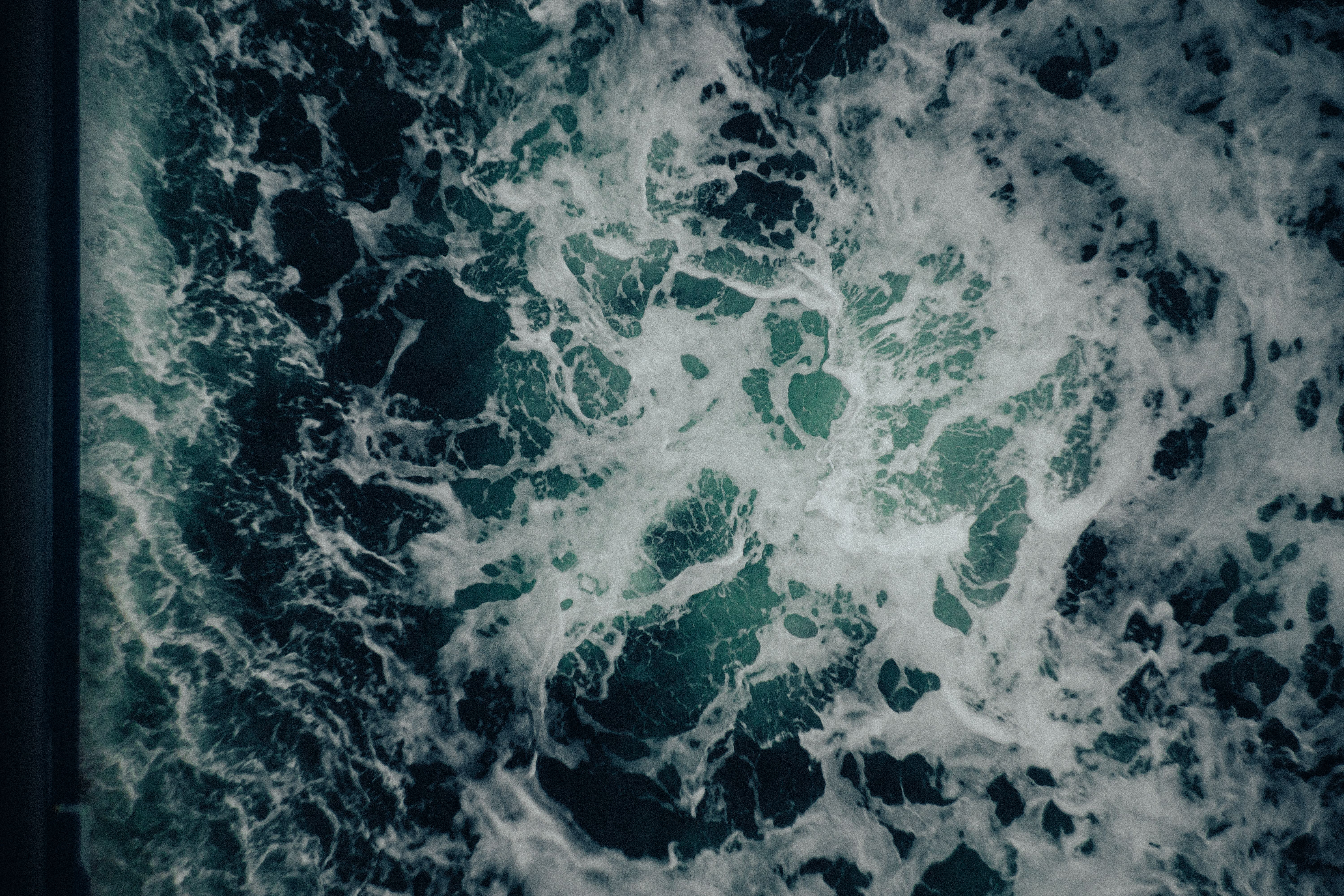 Aerial View of Ocean Waves and Foam Patterns · Free Stock Photo