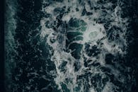 Aerial View of Ocean Waves Crashing with Foam