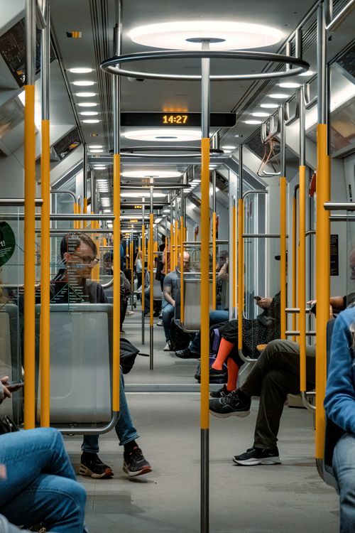 Free Passengers riding the modern Stockholm subway, showcasing daily urban life in Sweden. Stock Photo
