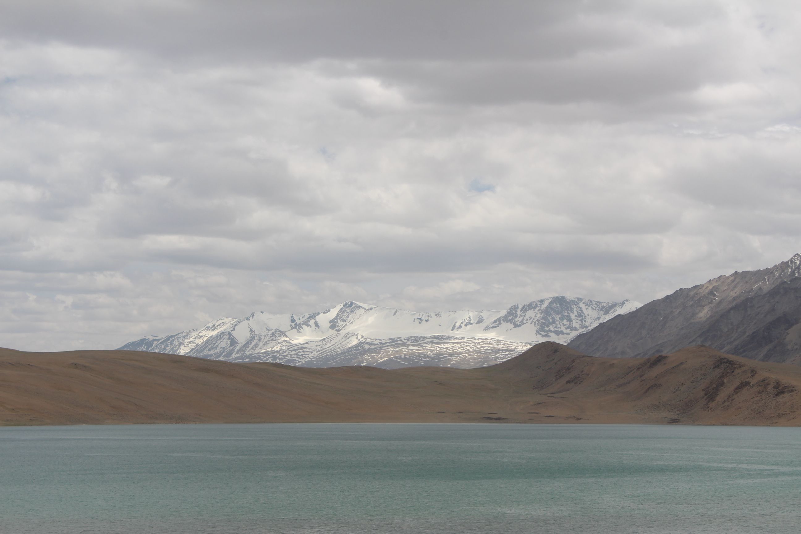 Serene Mountain Lake with Snow-Capped Peaks · Free Stock Photo