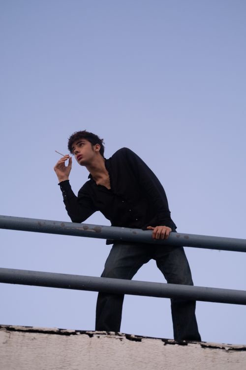 Man Posing on Rooftop in Istanbul at Dusk · Free Stock Photo
