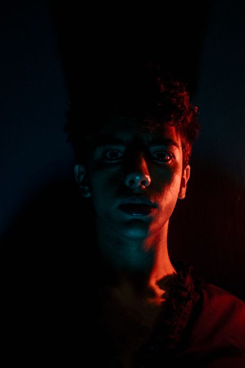 Free Moody portrait of a man with striking lighting in Istanbul, emphasizing mystery and intrigue. Stock Photo