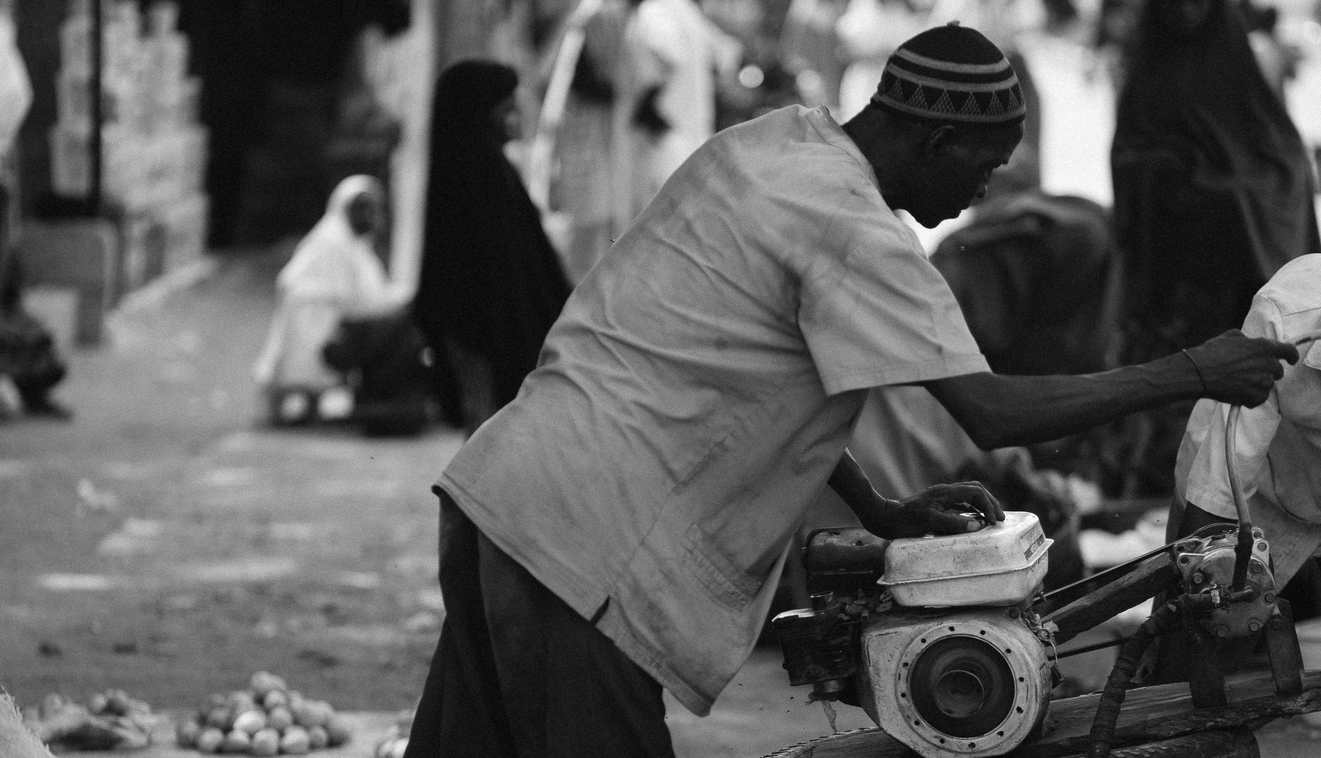 Black and White Street Vendor Scene in Market · Free Stock Photo