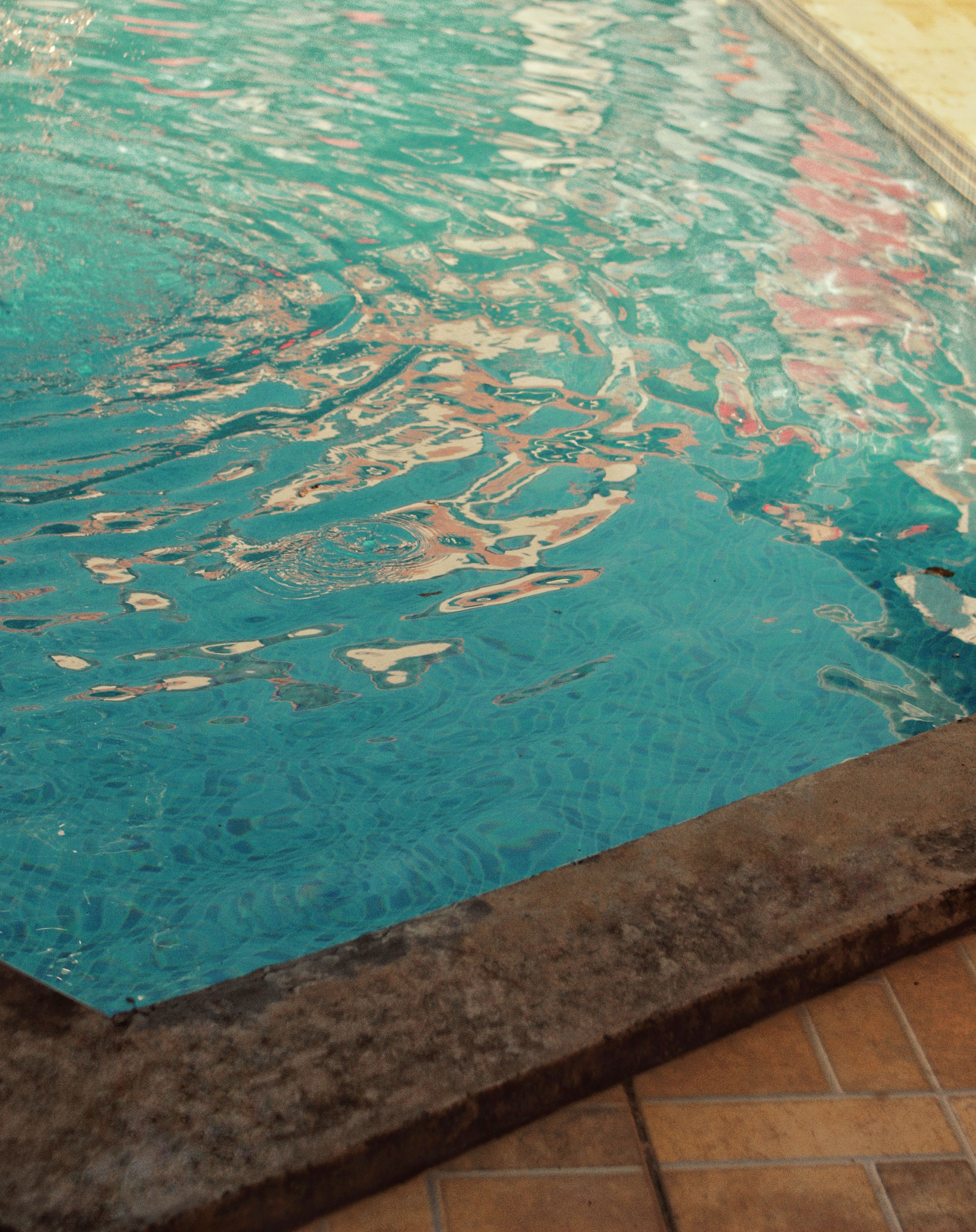 Calm and tranquil swimming pool with shimmering water effects.