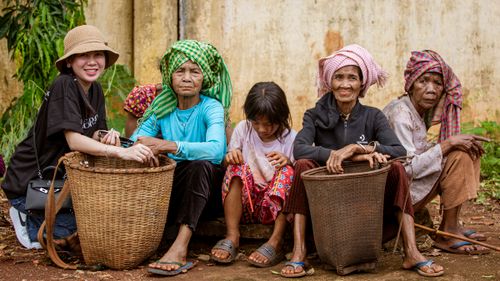 Free Group portrait of Southeast Asian women and child in Phước Long, Vietnam, showcasing cultural heritage. Stock Photo