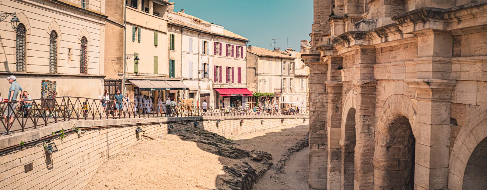 Picturesque street scene in Arles, featuring historic architecture and summer ambiance.