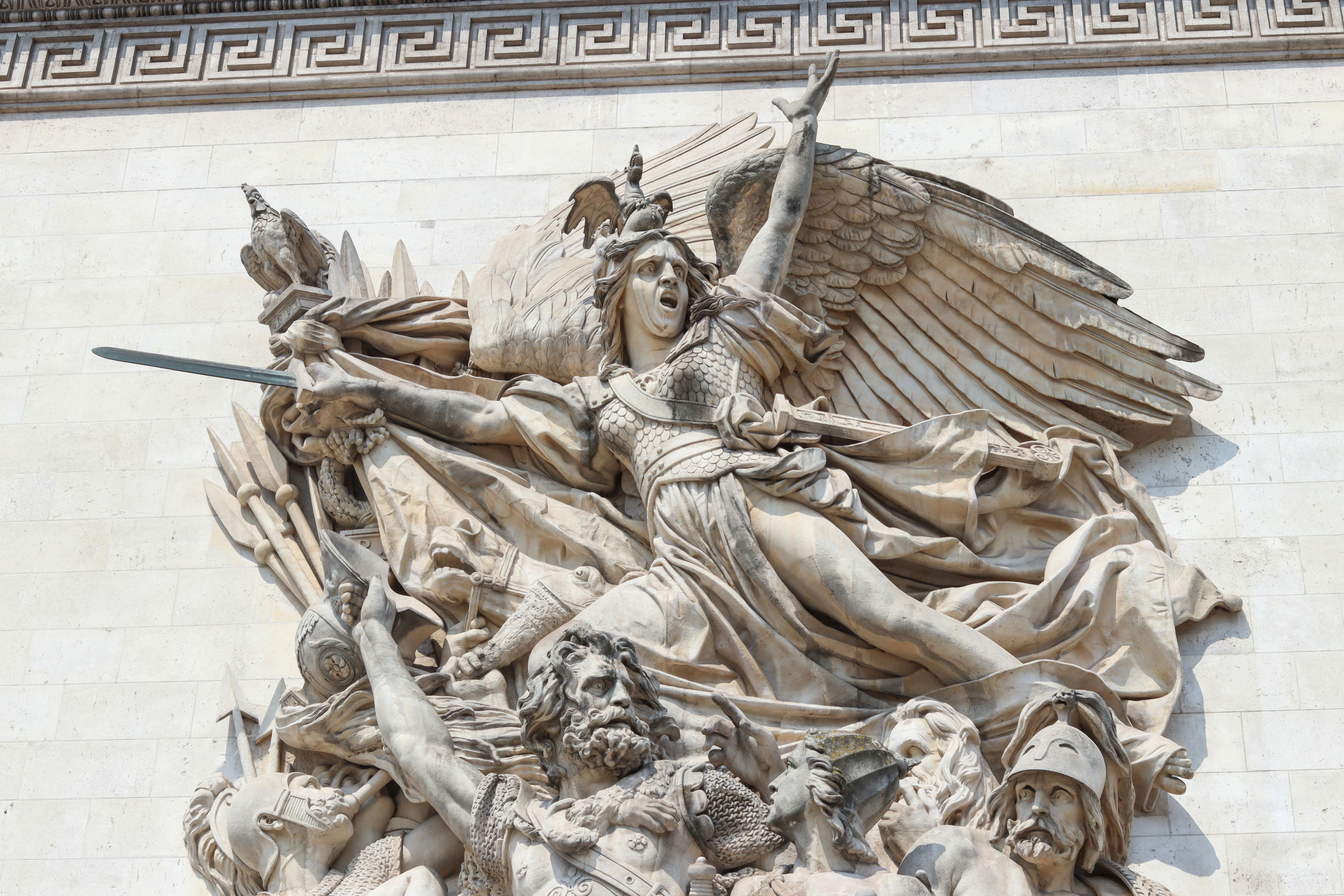 Close-up view of La Marseillaise sculpture on the Arc de Triomphe in Paris, depicting passionate French revolutionaries.