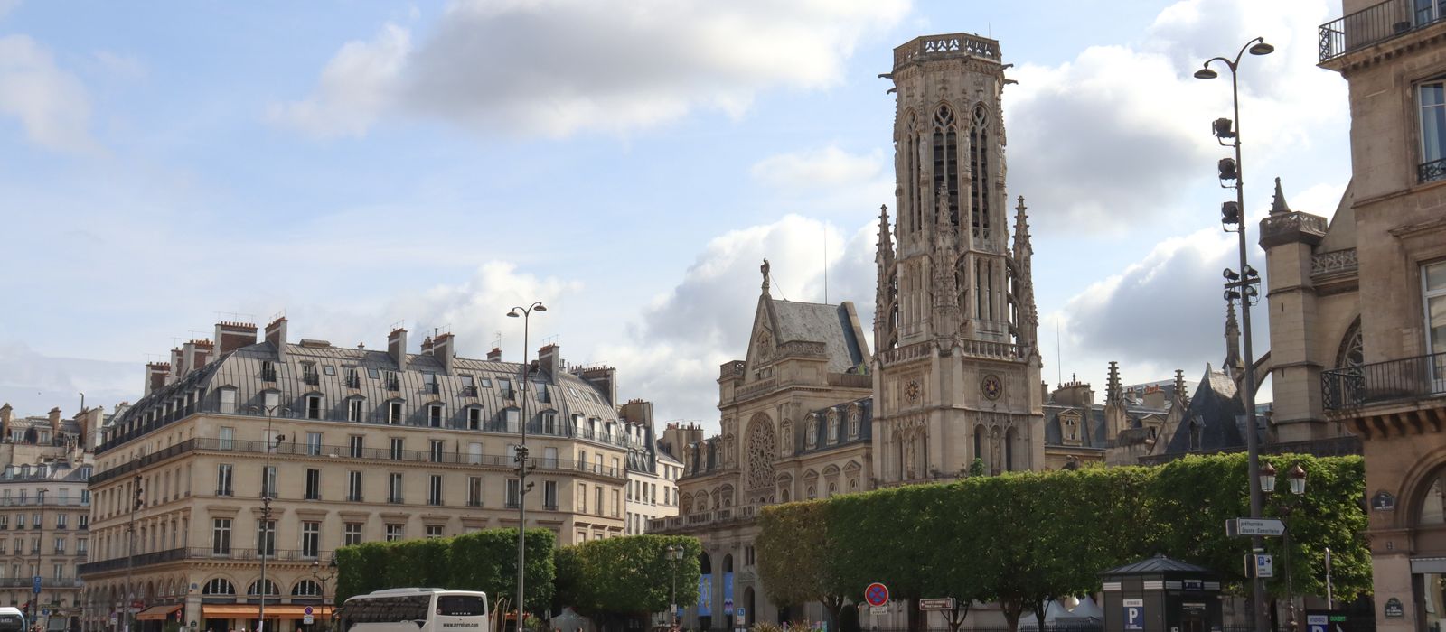 Capture of the iconic Saint-Jacques Tower in sunny Paris, France, showcasing classic architecture.