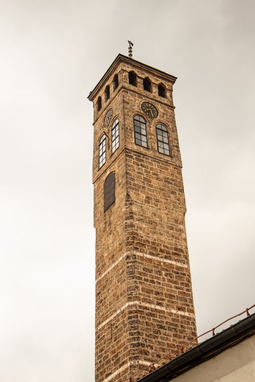 Free Capture of a historic clock tower in Sarajevo, showcasing architectural elegance. Stock Photo