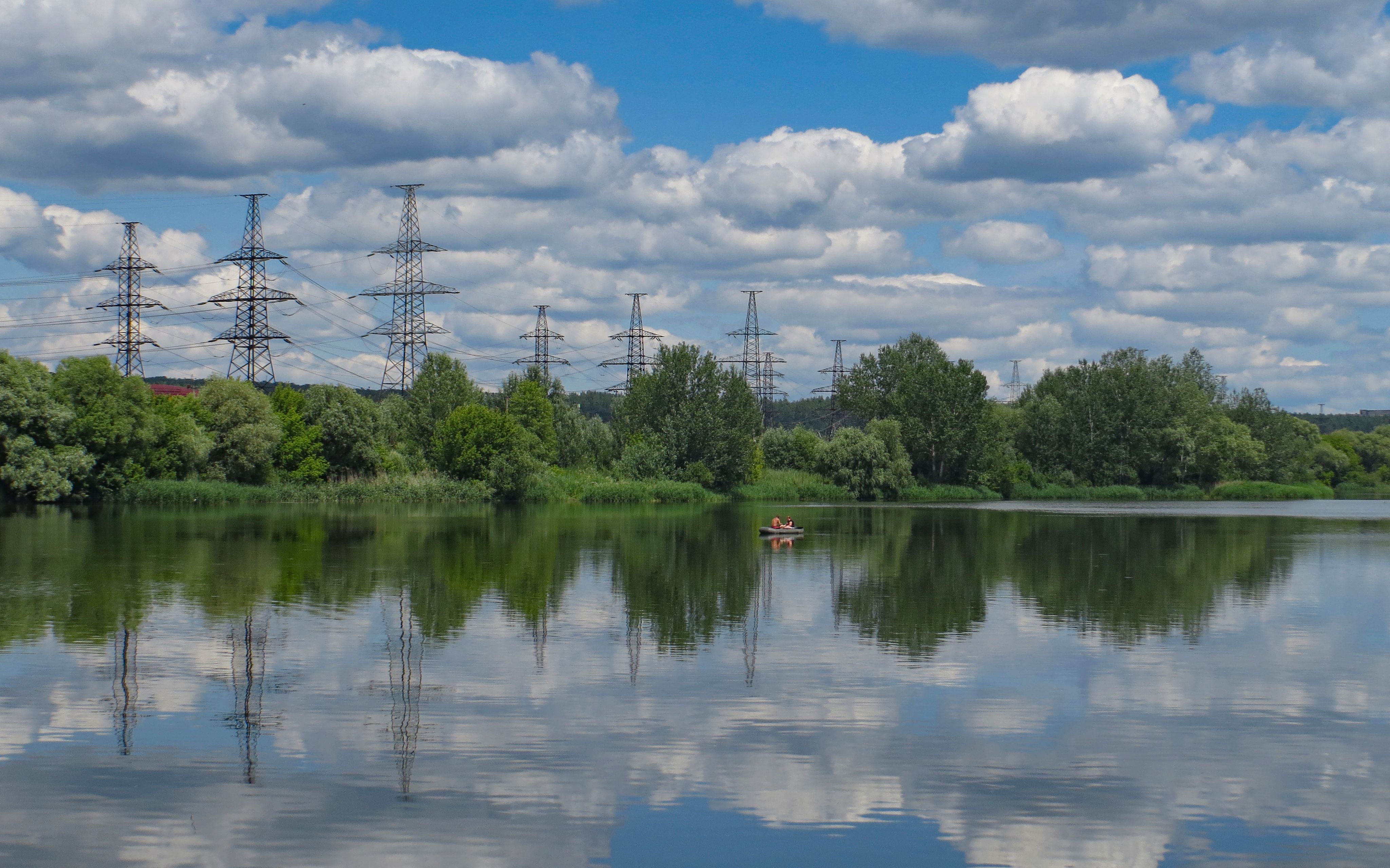 Scenic River Landscape with Power Lines · Free Stock Photo