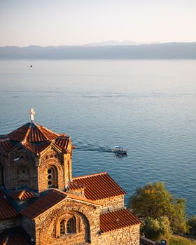 Beautiful vista of St. John at Kaneo church overlooking Lake Ohrid with tranquil waters.