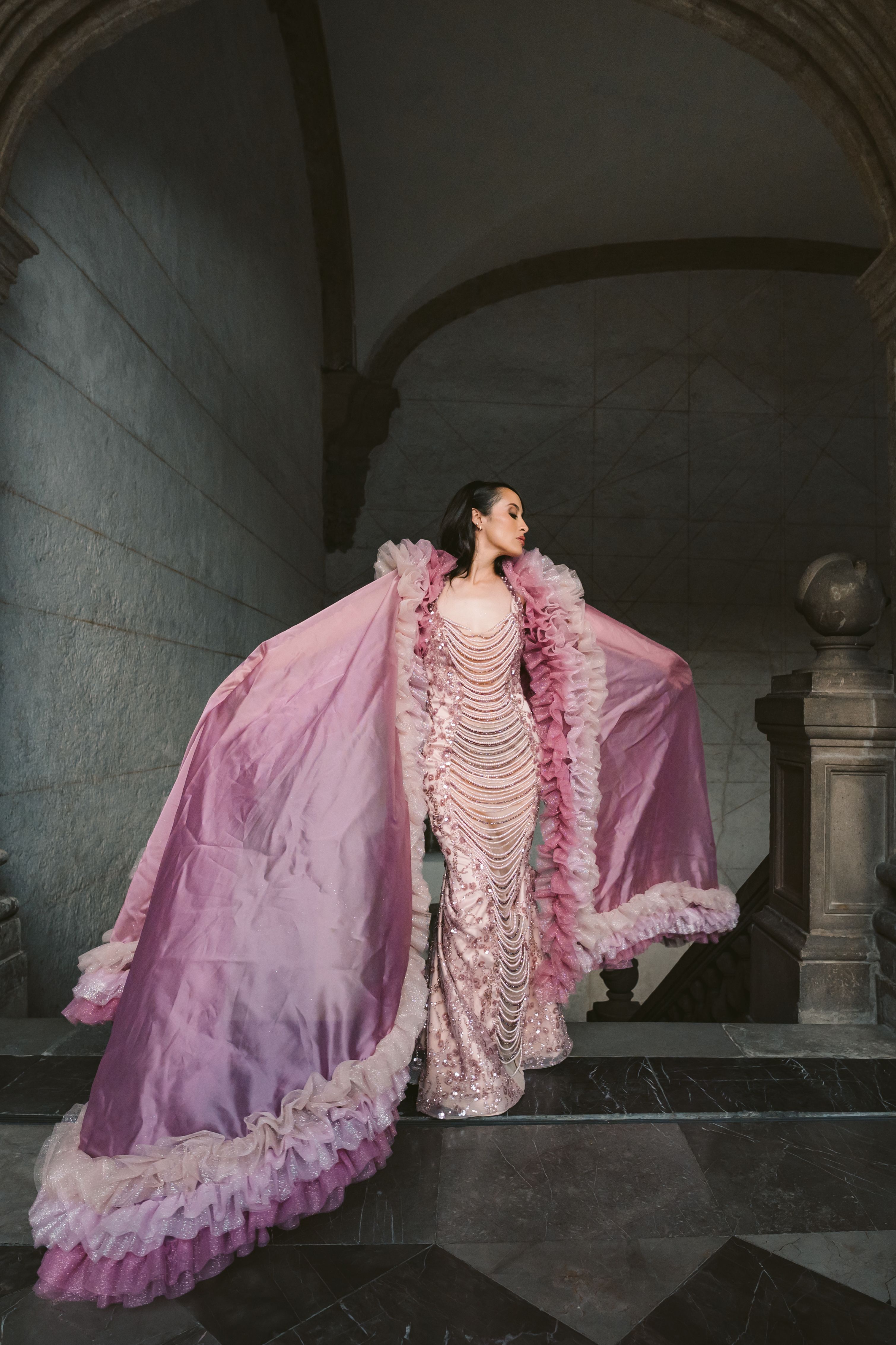[ColoSach]-a-woman-poses-in-a-luxurious-pink-gown-inside-a-historic-building-in-mexico-city.