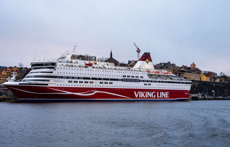 Viking Line cruise ship docked in Stockholm, Sweden with cityscape backdrop.