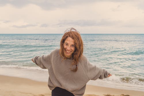 Free Woman Having Fun By The Sea Stock Photo