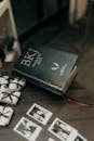 Open Bible with Polaroids and Gifts on Wooden Table