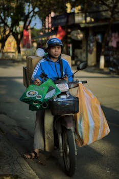Motorcycle courier carrying parcels on a city street, symbolizing urban logistics and service delivery.