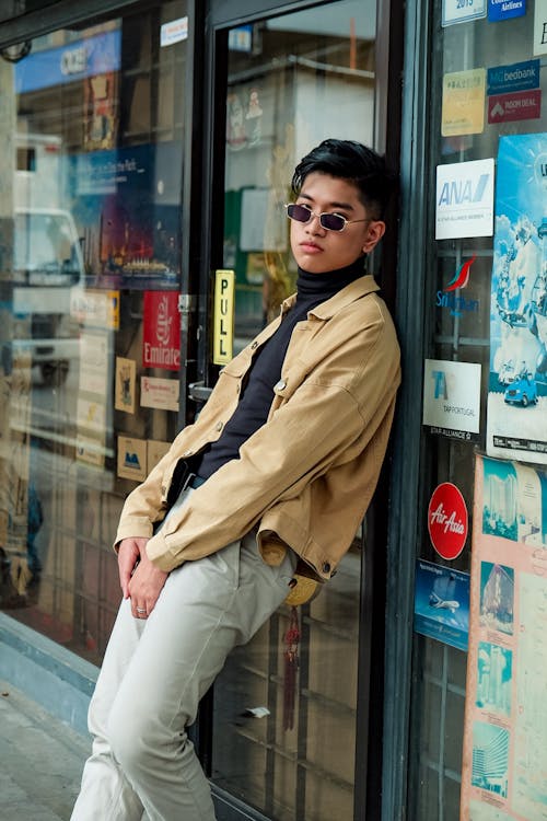 Man Leaning on A Glass Door