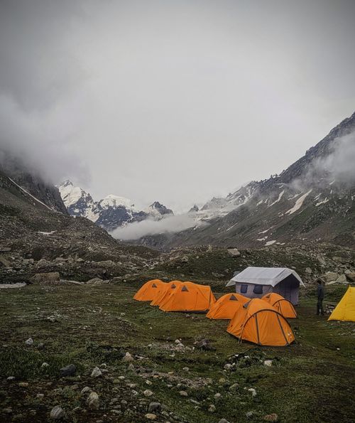 Free Capture of orange tents set against the breathtaking Himalayas in Manali, India. Stock Photo
