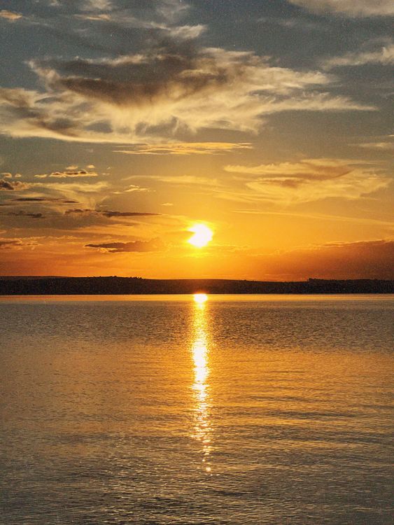 Golden Sunset Over Tranquil Lake Waters · Free Stock Photo
