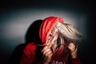 Person Wearing Red Hoodie