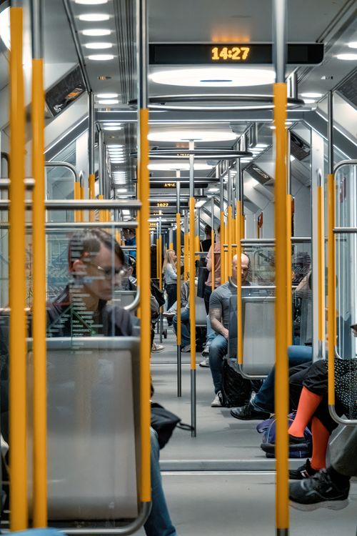 Free Stockholm Metro train interior with commuters. Modern transportation scene. Stock Photo