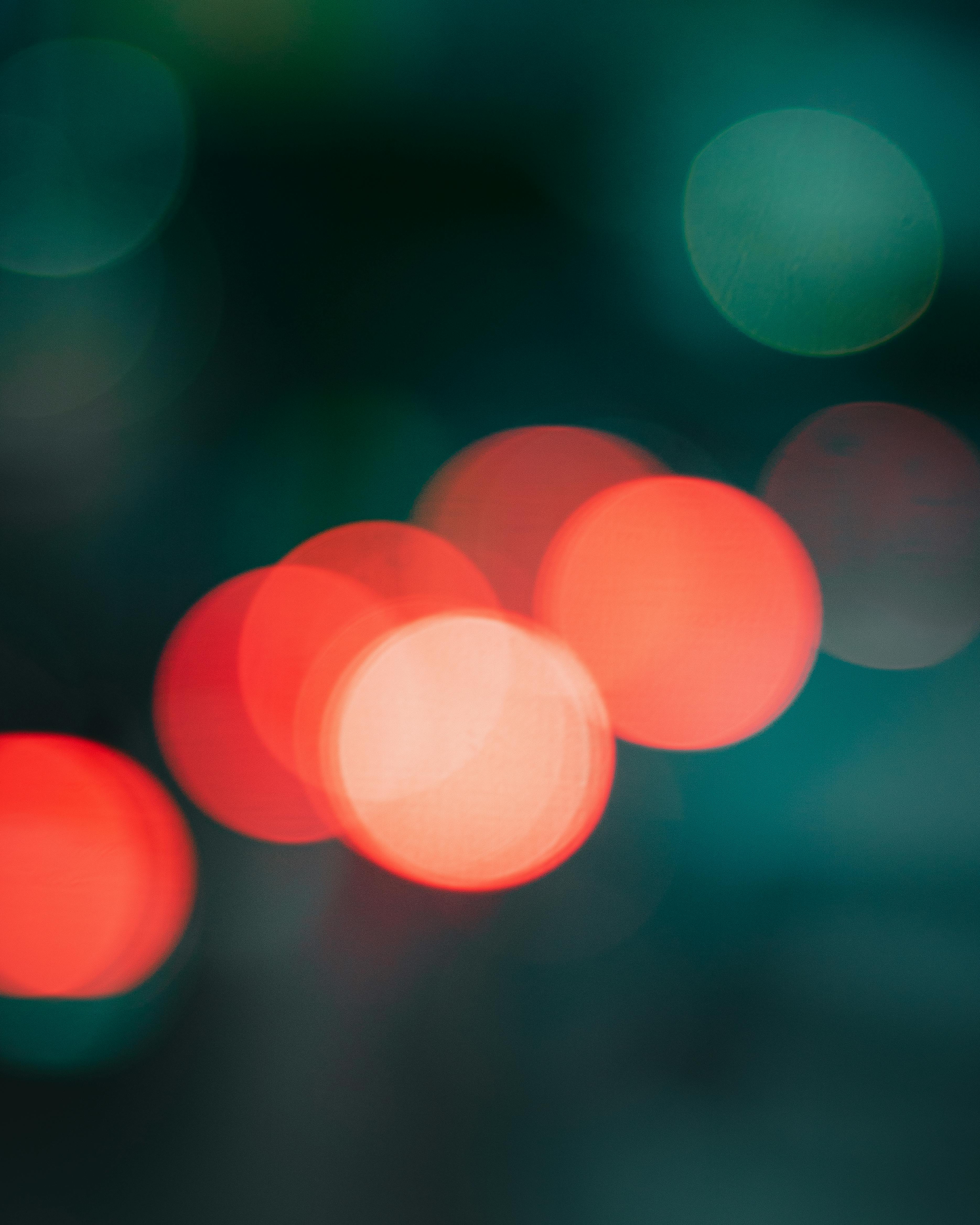 Vibrant abstract bokeh lights on dark background, creating a captivating visual.