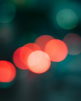 Vibrant abstract bokeh lights on dark background, creating a captivating visual.