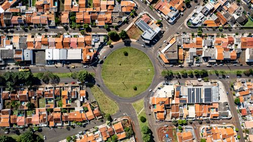 Free Aerial shot of a busy roundabout in Londrina, Brazil, showcasing urban landscape. Stock Photo