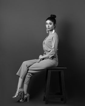 Stylish woman posing in black and white. Classic fashion statement.