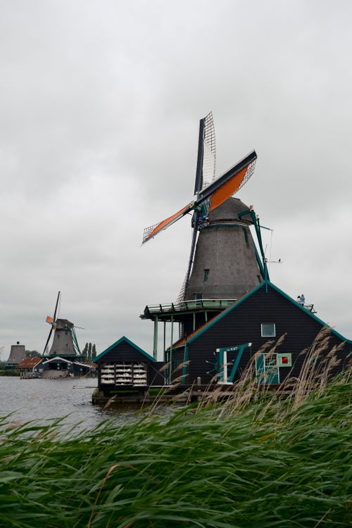 Free Picturesque view of traditional windmills in Zaandam, Netherlands, reflecting Dutch heritage. Stock Photo