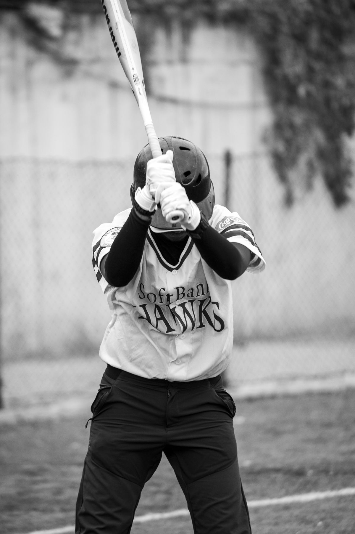 A batter set in the box, ready to swing.