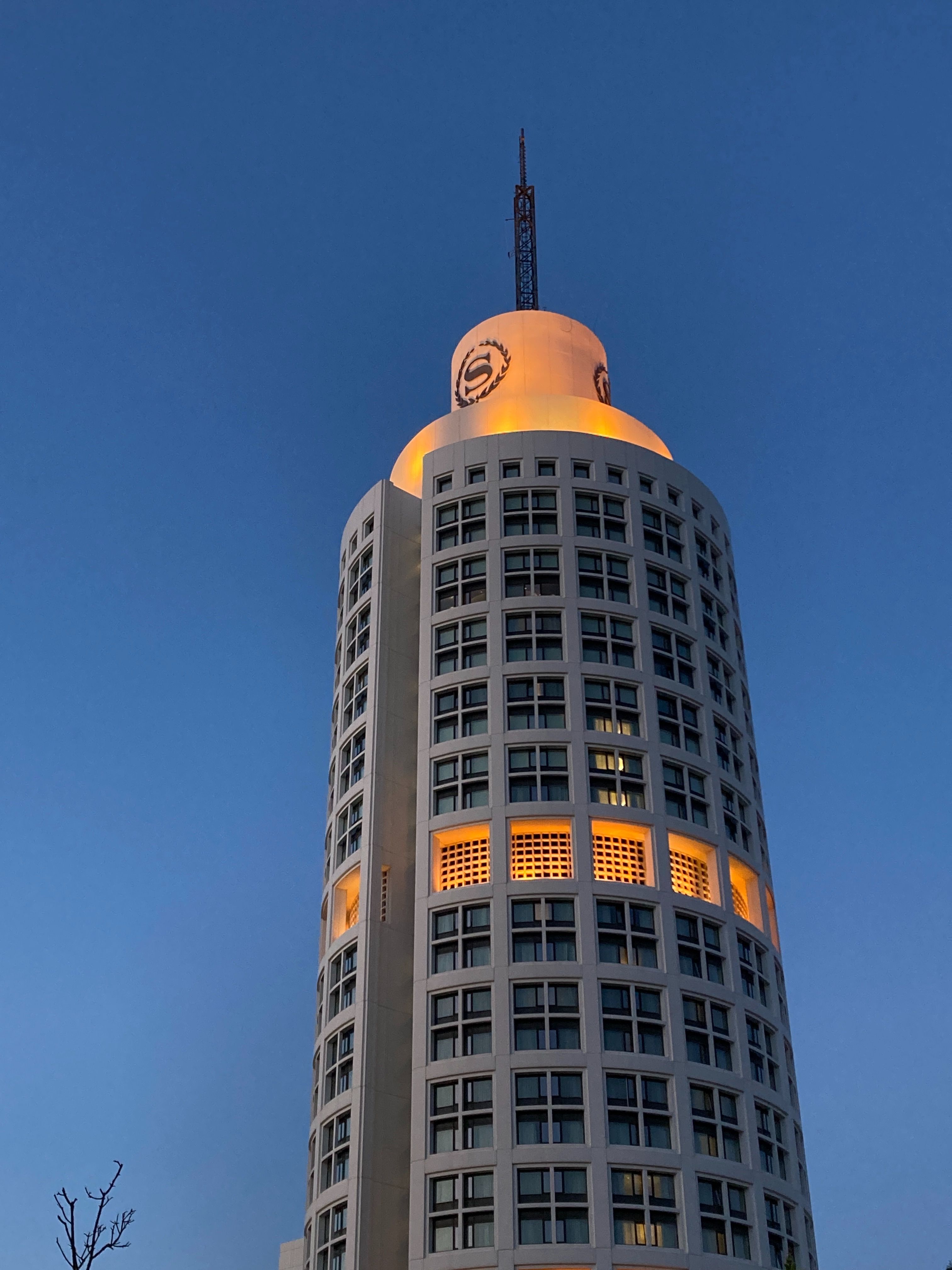 Tall Modern Building Against Clear Blue Sky · Free Stock Photo