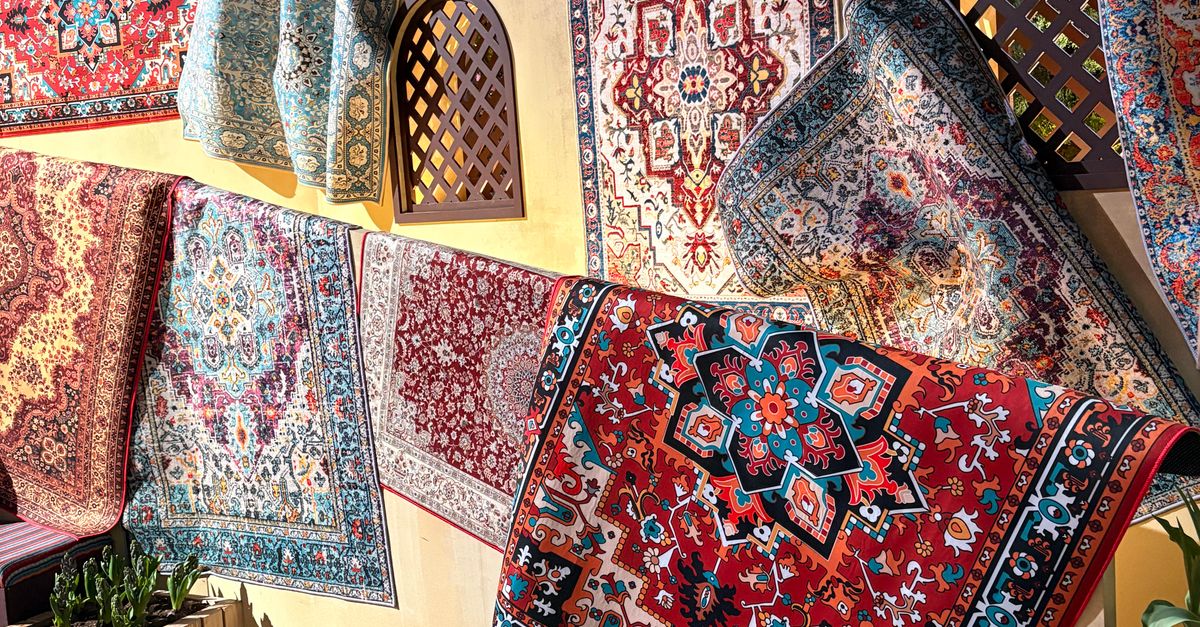 Persian Rug Display Vibrant Display of Persian Rugs in an Outdoor Market · Free Stock Photo