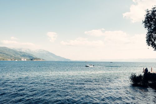 Free Serene lake with mountains in North Macedonia. Peaceful ambiance and natural beauty. Stock Photo