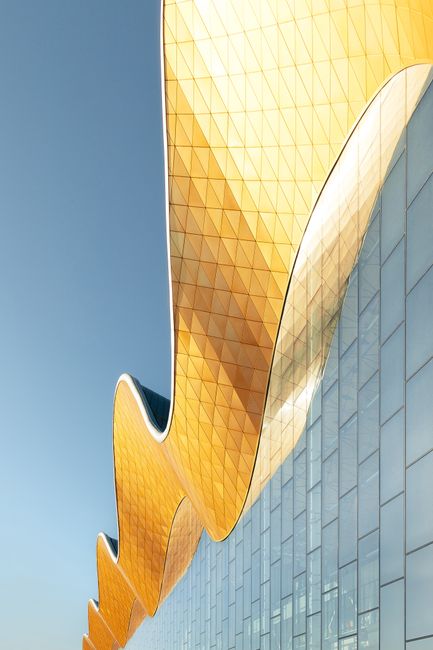 Stunning modern architecture with a gold and glass facade in Moscow, Russia.