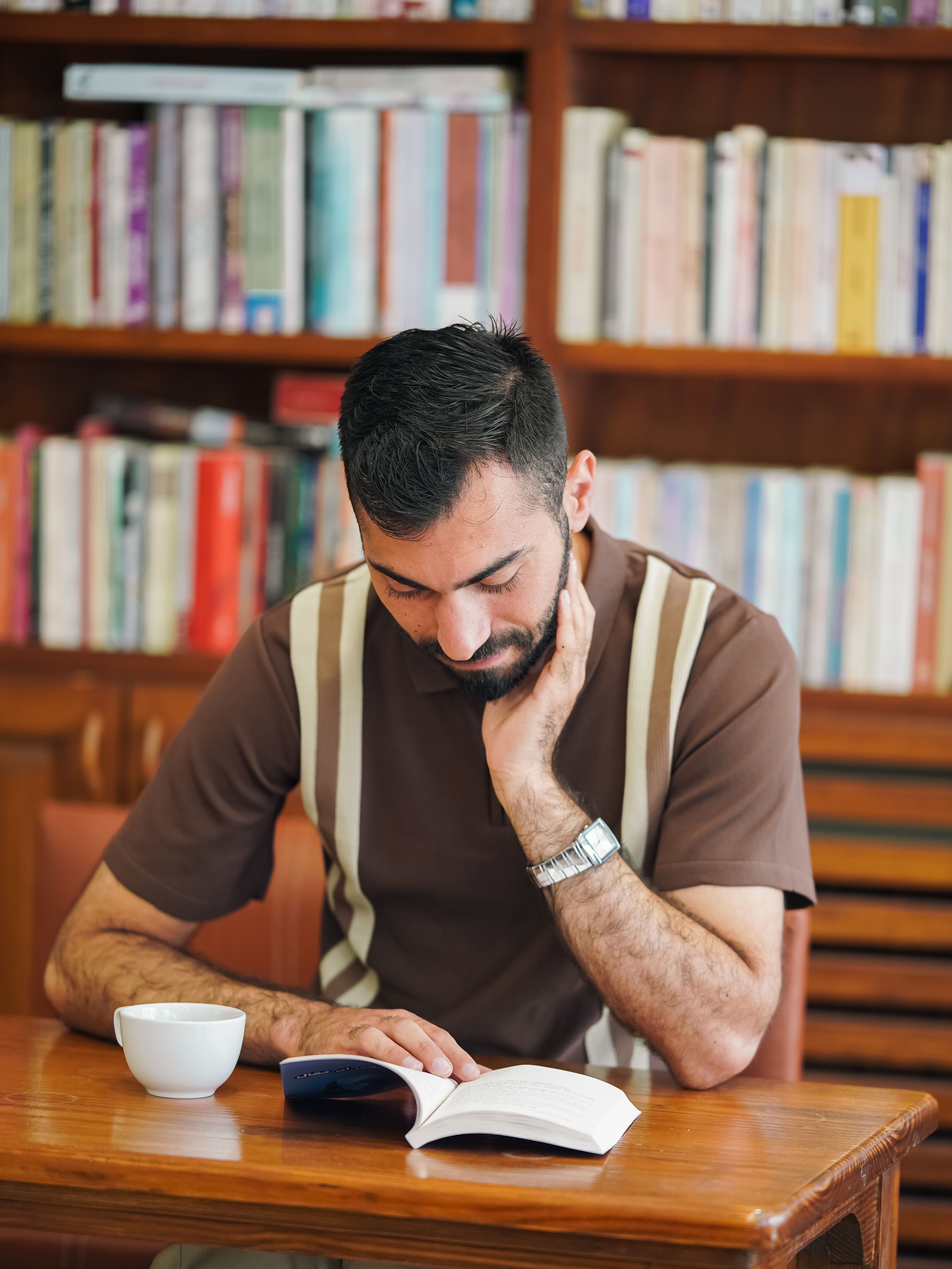Man Reading Book in Cozy Library Setting · Free Stock Photo