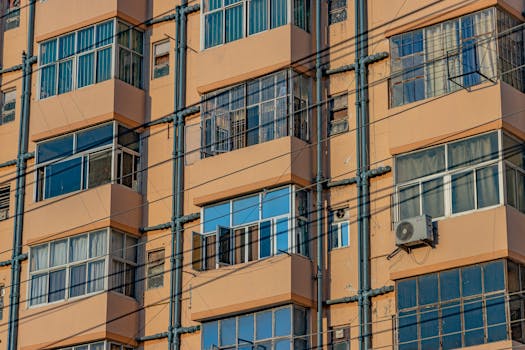 Detailed view of a brutalist apartment building in Lucknow, showcasing vibrant architecture and urban style.