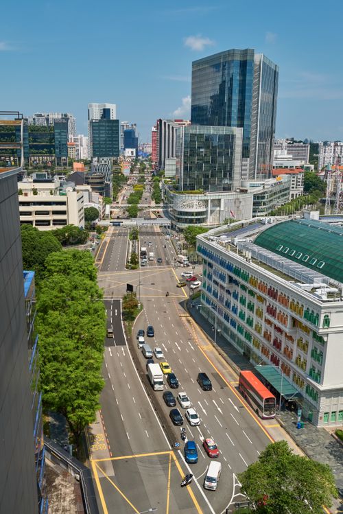 Free A vibrant city view with modern architecture, showcasing bustling urban life from above. Stock Photo