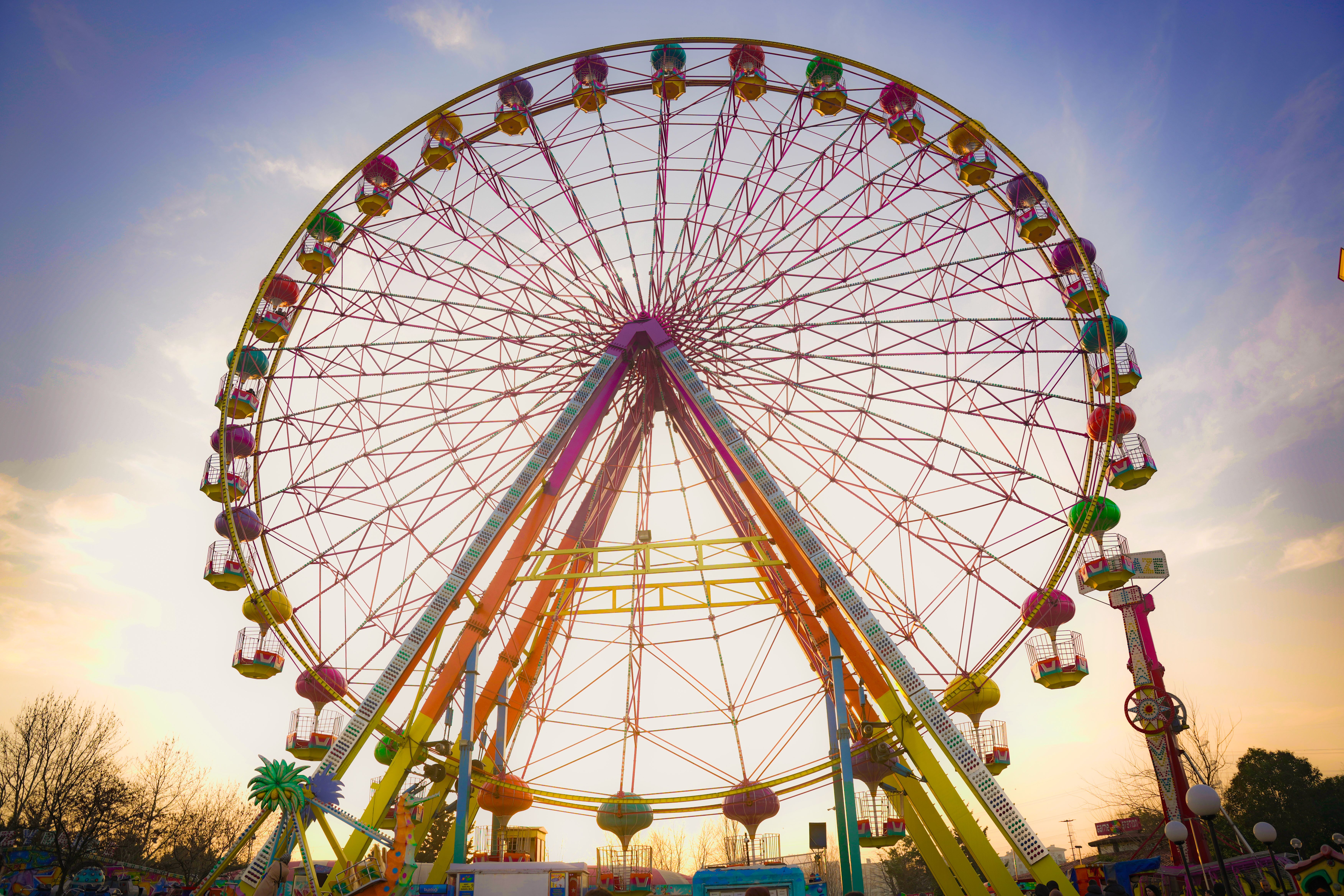 Colorful Ferris Wheel at Sunset in Amusement Park · Free Stock Photo